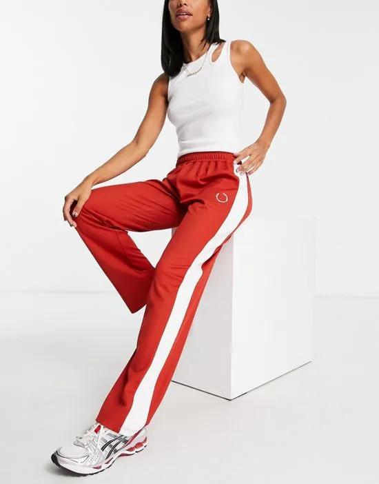 tricot oversized low rise straight leg sweatpants with side stripe in red