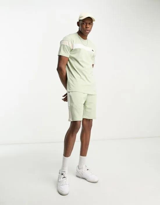 Turi jersey shorts with side stripe in light green