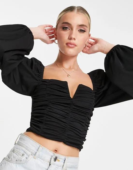v bar volume sleeve top with ruching in black