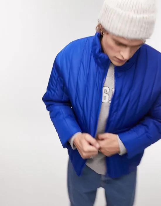 vertical puffer jacket in blue