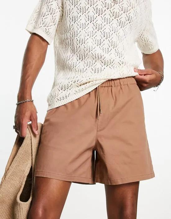 wide chino shorts in shorter length in tan