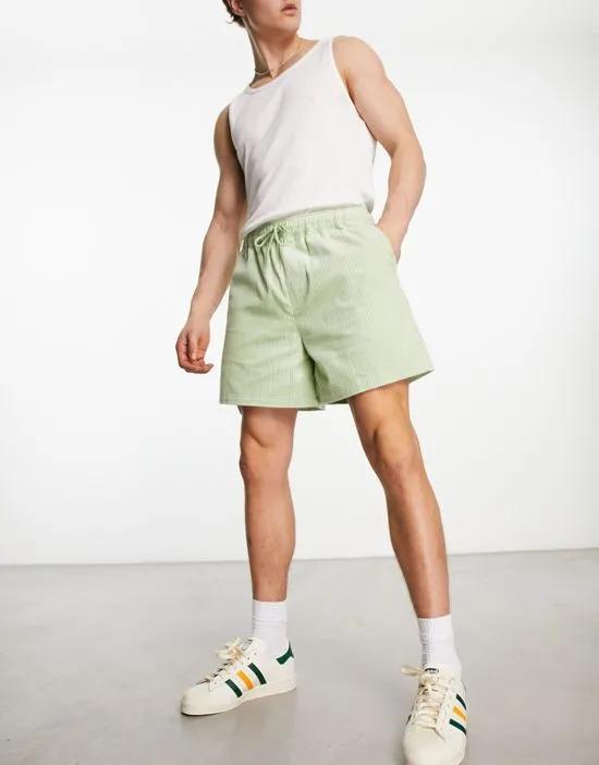 wide cord shorts in light green