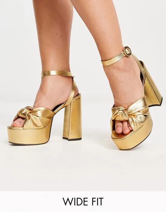 Wide Fit Natia knotted platform heeled sandals in gold