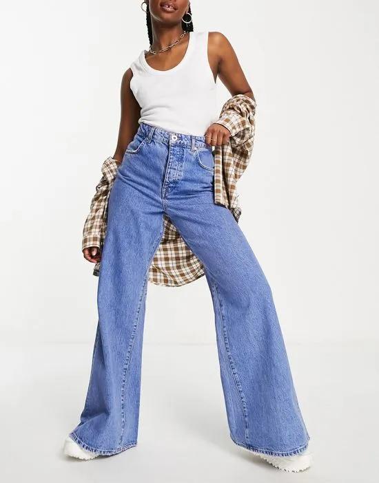 wide leg flared jeans with panel detail in medium blue