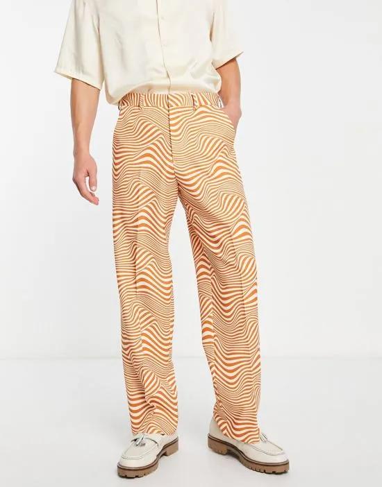 wide leg suit pants in white and orange swirl print