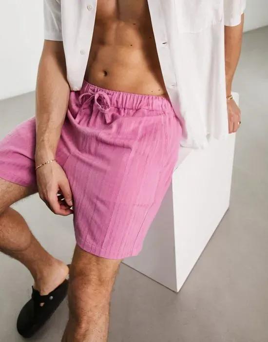 wide textured shorts in shorter length in pink