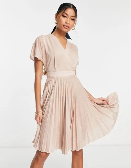 wrap front pleated mini dress in metallic rose gold