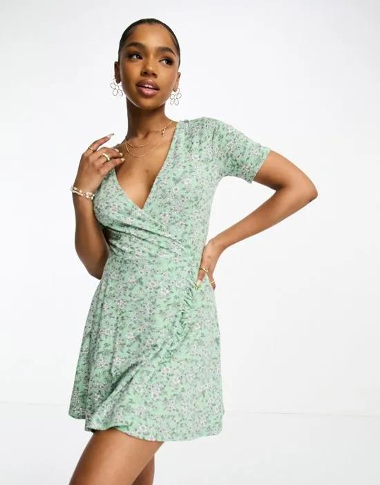 wrap mini dress in green ditsy floral