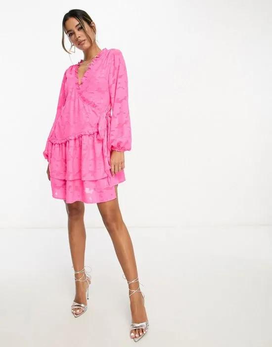 wrap mini dress with pep hem in pink jacquard