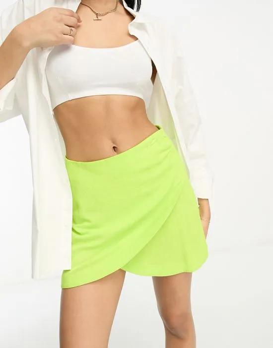 wrap mini skirt with linen in lime