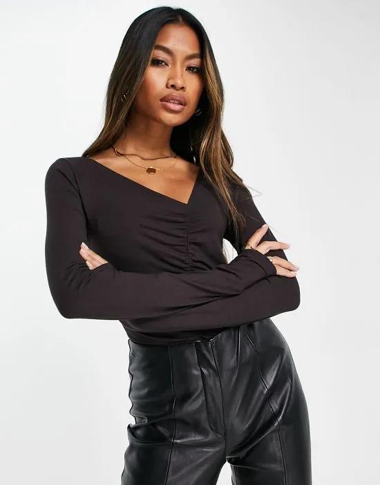 x Klara Montes asymmetric ruched top in washed black